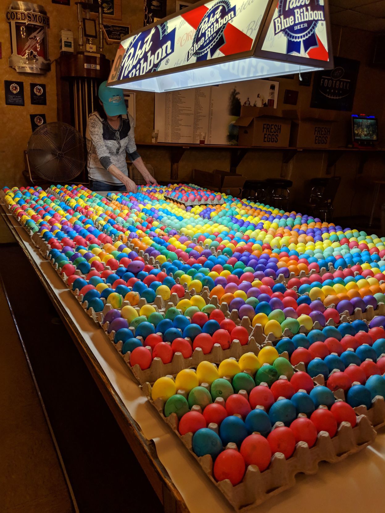 Easter eggs sit on a pool table in preparation for the Capitol Easter Egg Hunt
